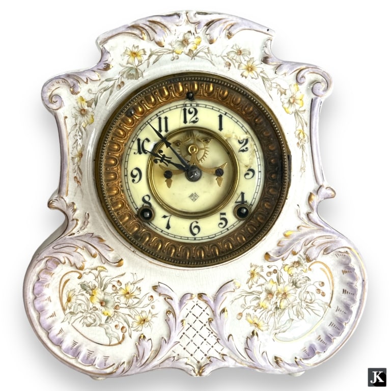 Antique Ansonia clock mounted in hand paintied floral porcelain clock case. Case marked with raised (1 of 5)