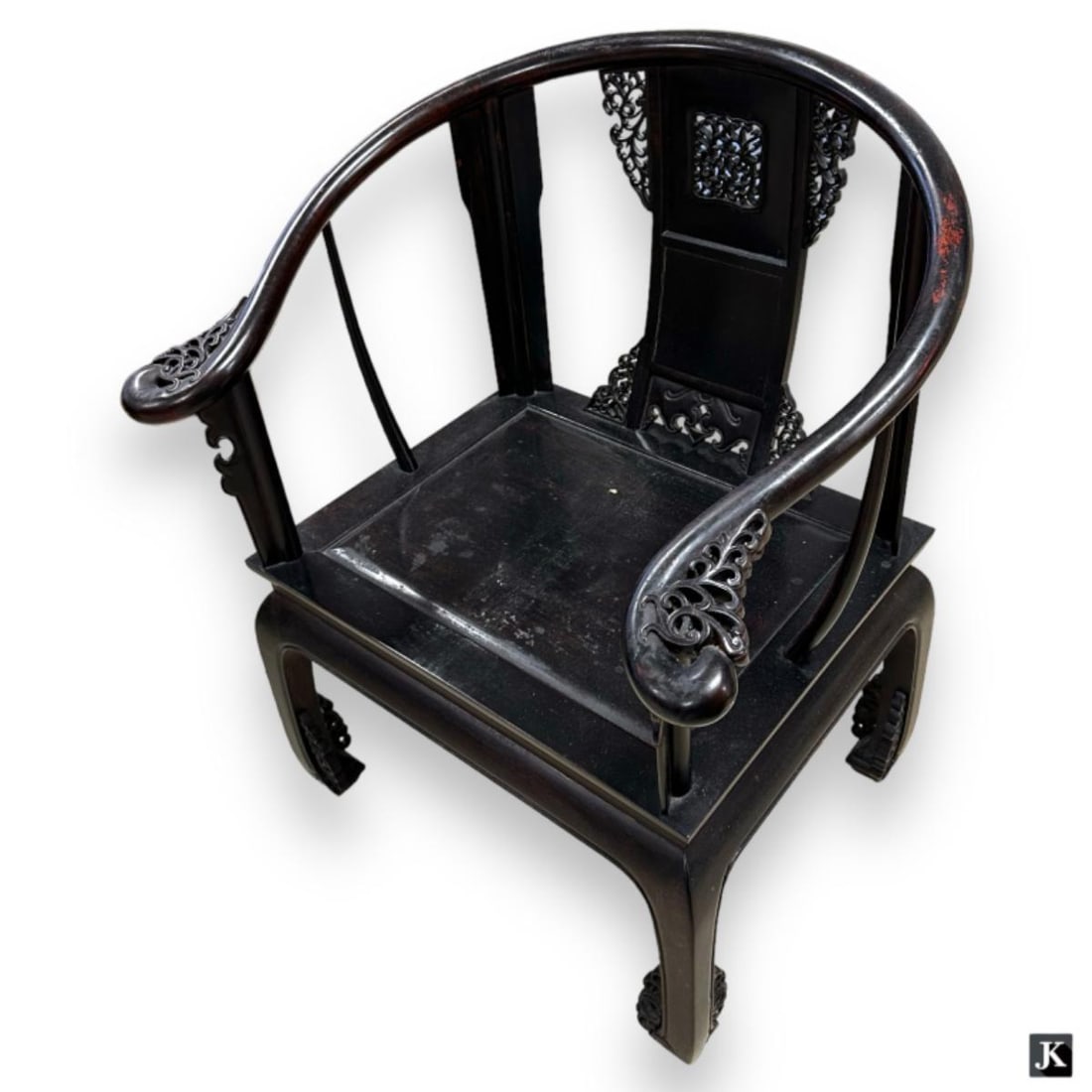 Vintage Chinese hand carved Zitan wood horse shoe back arm chair having ornate openwork scrolled: Vintage Chinese hand carved Zitan wood horse shoe back arm chair having ornate openwork scrolled accent designs. Measures approx. 36 1/4" x 29 1/4" width x 24 1/2" depth. Some typical surface wear ass