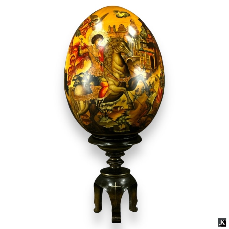 A Russian hand painted and artisan signed wooden lacquered egg depicting a Christian religious scene (1 of 4)