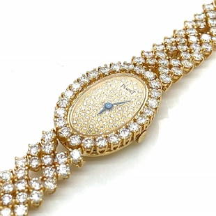 Item # 10115 Category Watches PIAGET 18K Yellow Gold Diamond Ladies Cocktail Watch Weighing 41.0: Item # 10115 Category Watches PIAGET 18K Yellow Gold Diamond Ladies Cocktail Watch Weighing 41.0 grams Set with 185 Diamonds weighing app. 16.50 Ct. Along with 82 Diamonds weighing app. 0.40 Ct. D-F C