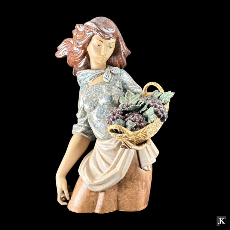 Lladro Spain Gres pottery sculpture depicting a young woman holding a basket with grape clusters and (1 of 7)