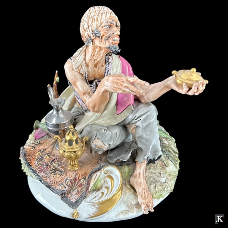 A vintage Italian Orientalist porcelain scculpture depicting an Arab street vendor. Bottom marked: A vintage Italian Orientalist porcelain scculpture depicting an Arab street vendor. Bottom marked "MADE IN ITALY WORKS OF ART NO. 2612". We have seen similar pieces also bear the Capodimonte mark...ho