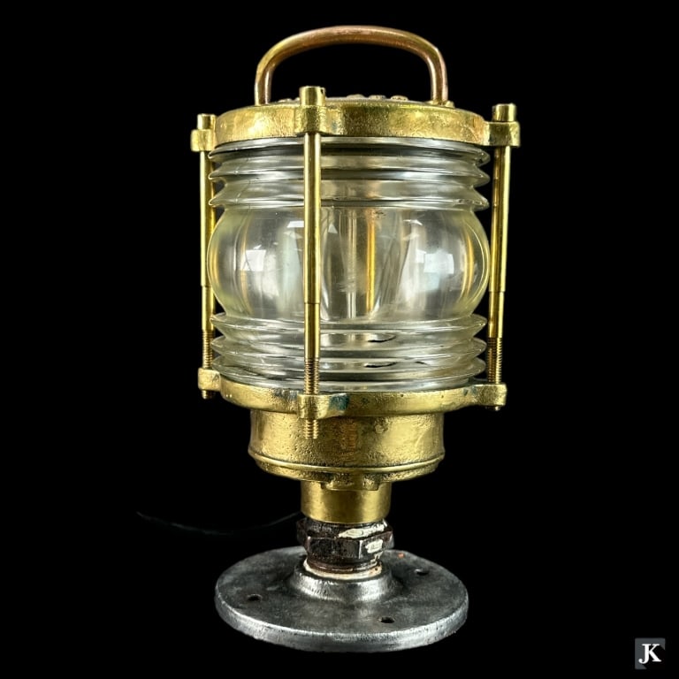 A vintage TEF 990-00 bolt down ship's lanter crafted of gilt brass and stainless steel. Wired for: A vintage TEF 990-00 bolt down ship's lanter crafted of gilt brass and stainless steel. Wired for home use. Measures approx. 10 1/4" height x 6" diameter. Some wear to metal. Unsure if functional. JD/