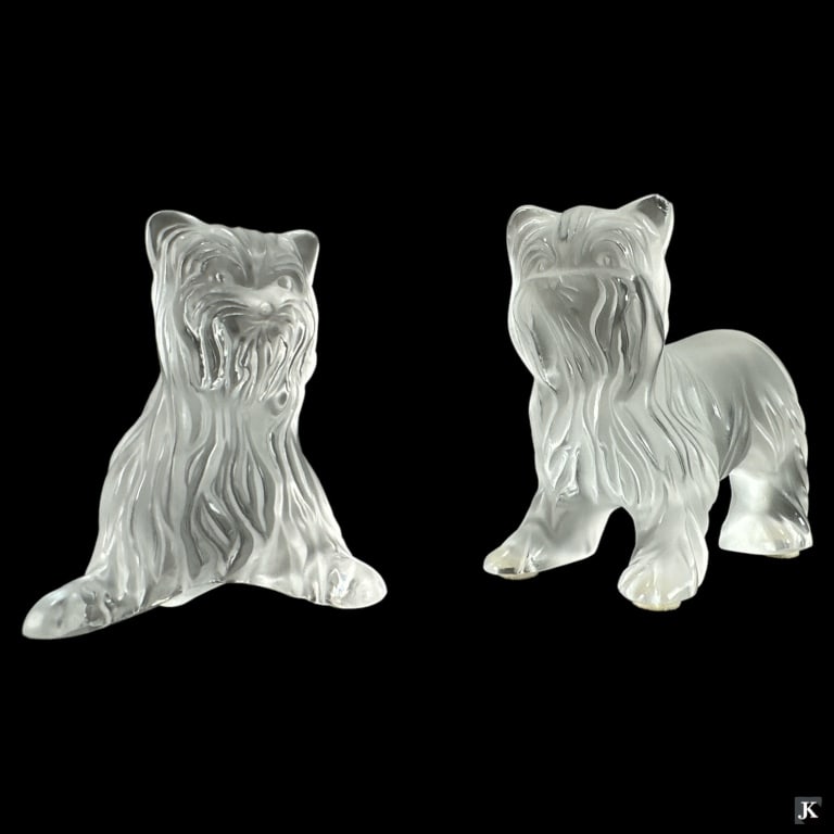 Lot Of 2 Lalique France Terrier Dog Sculptures: A lot of 2 Lalique France terrier dog sculptures. Each signed. Tallest approx. 3 1/2" height. Chip to ear of standing dog. JD/B13/CB:B
