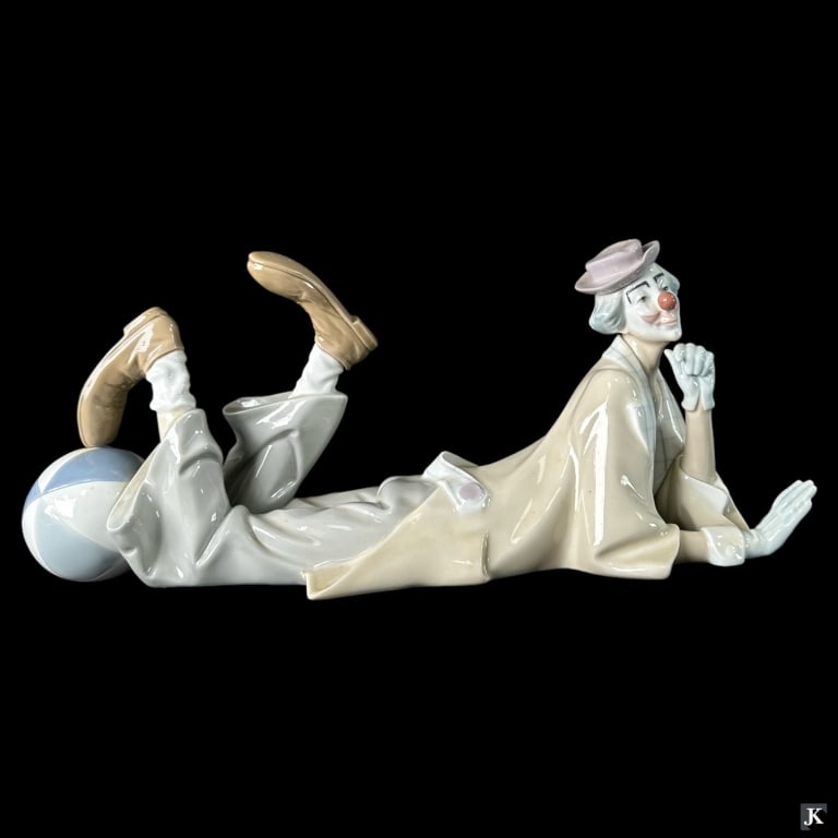 Lladro Spain "Clown" Porcelain Figure #4618: Lladro Spanish glazed porcelain sculpture titled "Clown" or "Payaso Acostado" number 4618. Sculpted by Salvador Furió. Issued in 1970 and retired in 2019. Measures approx. 6 1/4" height x 13 3/4" len