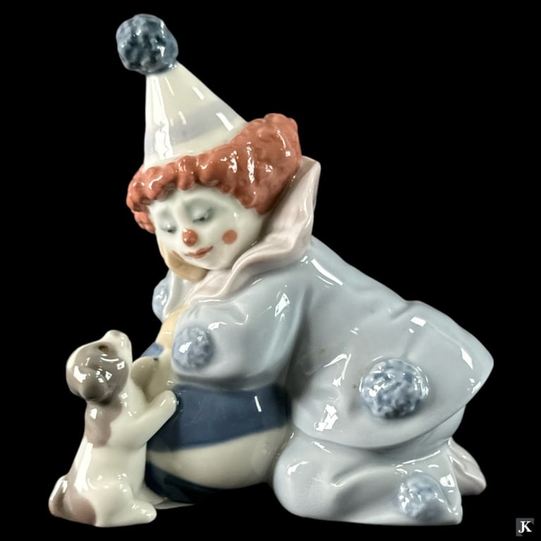 Lladro Spain "Pierrot W/ Puppy & Ball" Figure 5278: Lladro Spanish glazed porcelain figure titled "Pierrot With Puppy & Ball" or "Nino Pierrot Con Perro y Pelota" number 5278. Sculpted by José Puche. Issued in 1985 and retired in 2007. Measures approx
