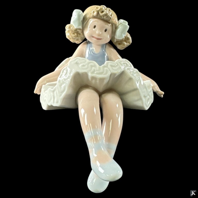 Lladro Spain "Rag Doll" Porcelain Figure #1501: Lladro Spanish glazed porcelain sculpture titled "Rag Doll" or "Muneca de Trapo Sentada" number 1501. Sculpted by José Puche. Issued in 1985 and retired in 1991. Measures approx. 4" height. Includes 