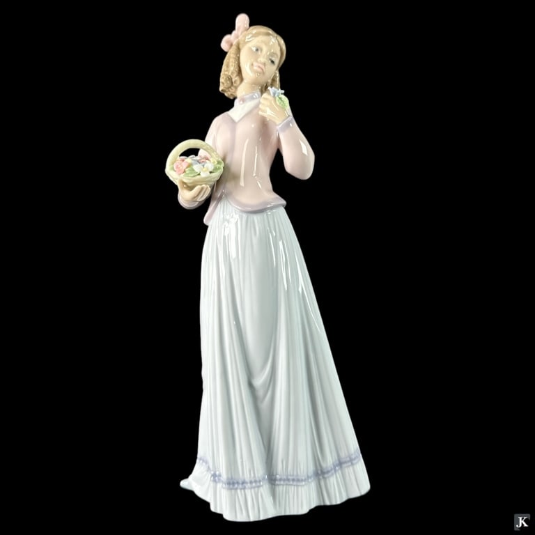 Lladro Spain "Innocence In Bloom" Figure #7644: Lladro Spanish glazed porcelain figure titled "Innocence in Bloom" or "Aroma Primavera" number 7644. Sculpted by José Puche. Issued in 1996 and retired in 1996. Measures approx. 9 3/4" height. Includ