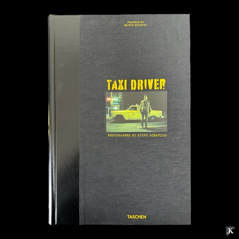 Taxi Driver By Taschen Limited Edition Book: "Taxi Driver" by Taschen in clamshell. Limited edition of 1000. Book measures approx. 17 1/2" length x 11 1/2" width. Clamshell measures approx. 19" height x 13" width x 3" depth. Some minor wear to c