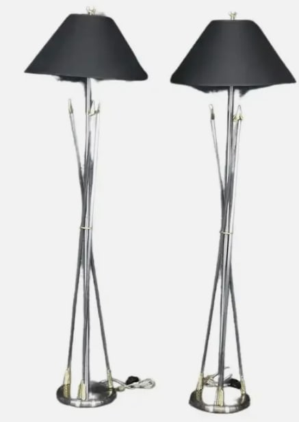 Pair of Maison Jansen Style Brass and Steel Floor: Pair of Maison Jansen Style Brass and Steel Floor Lamps. This is beautiful paid of steel and brass floor lamps in the style of Andre Arbus or Maison Janse with arrows and brass ormolu. Measures 66.75