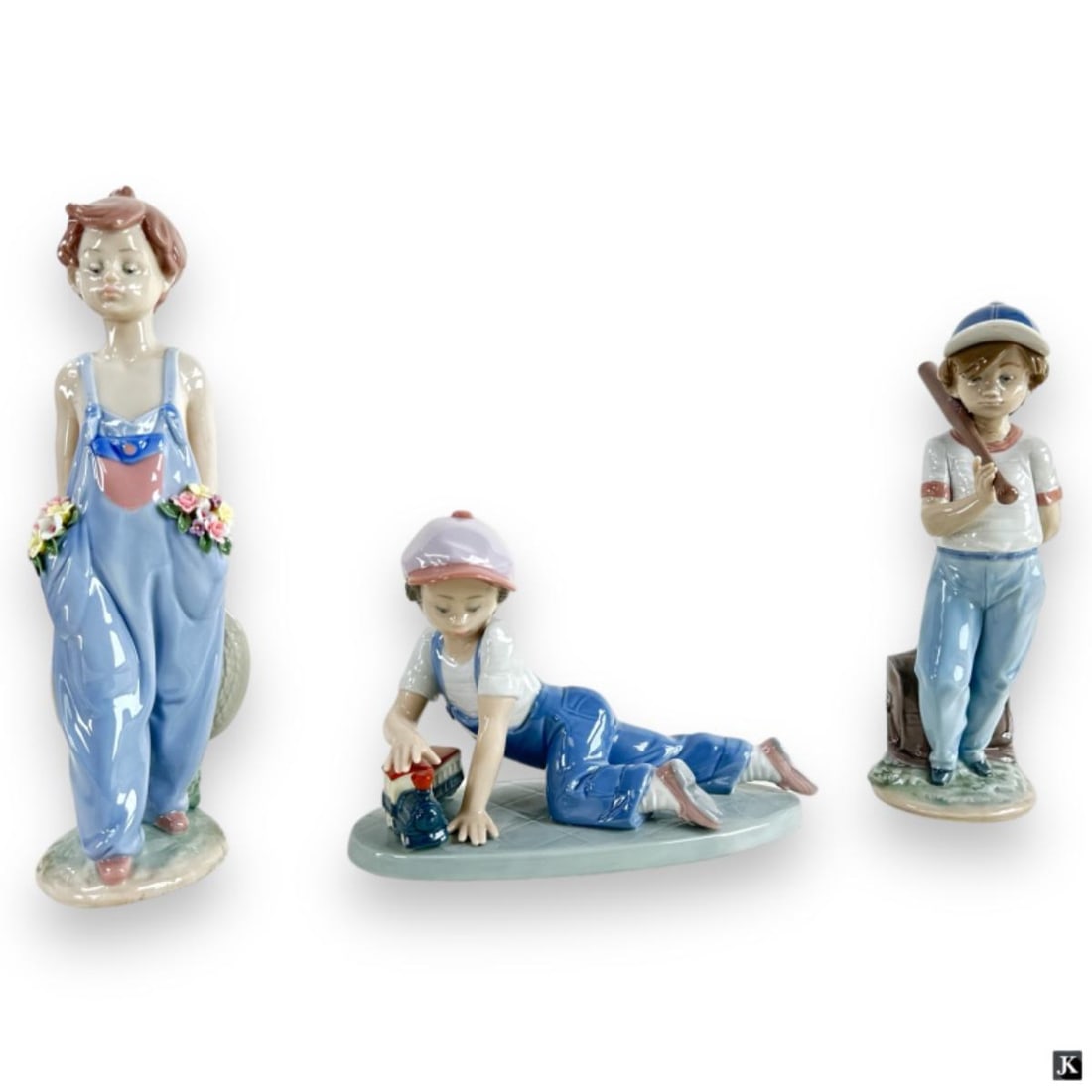 Lot Of 3 Lladro Collector's Society Boy Sculptures: A lot of 3 Lladro Spanish glazed porcelain Collector's Society sculptures depicting young boys. Lot is to include "Pocket Full Of Wishes" #7650, "Can I Play" #7610 and "All Aboard" #7619. Tallest meas