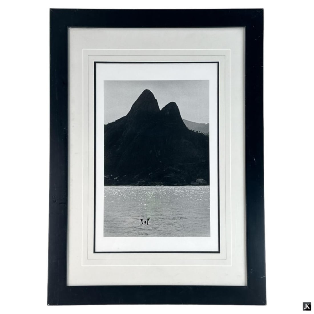 Elliot Everett Signed Photograph Of Snorkeler: Elliot Everett signed photograph depicting a Snorkeler swimming in a lake with mountains seen in the background. Hand pencil signed to verso. Mounted in a black painted wooden frame with mat behind ac