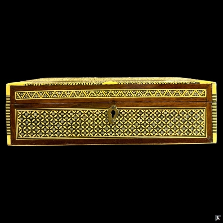 Vintage Moroccan MOP & Bone Inlay Dresser Box: A vintage Moroccan wooden dresser / jewelry box having an ornate mosaic inlaid design with mother of pearl, abalone, bone and ebony. Measures approx. 3 1/4" height x 10 1/4" width x 6 1/2" depth. We d