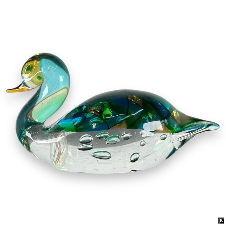 Ogetti Murano Italy Art Glass Duck Sculpture: Ogetti Murano Italian art glass bird sculpture depicting a duck. Artist signed to bottom and retains factory label. Measures approx. 6" height x 11 1/2" length x 4 1/2" depth. Appears in overall good