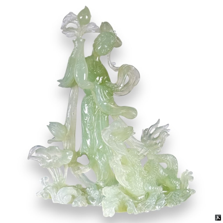 Vintage Carved Celadon Jade Figurine: Vintage Carved Celadon Jade Figurine. Depicts a girl with dragon. Etched mark on bottom. Losses along top and left side. Measures 10" H x 9-3/4" L.32S***All items must be removed from the auction hous