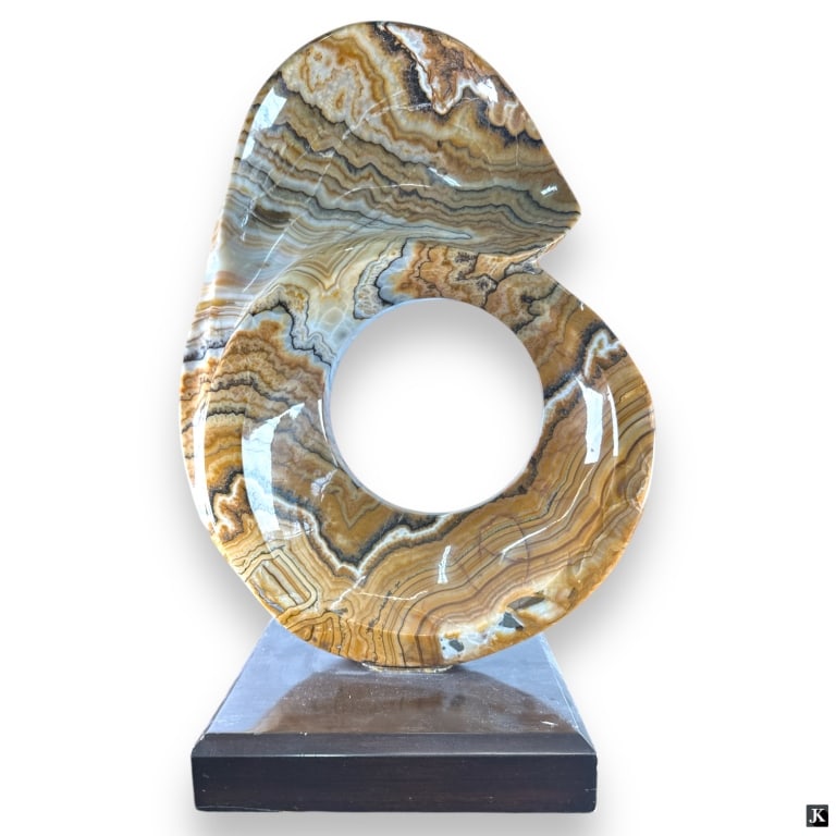 Vintage Onyx Sculpture on Wood Base: Vintage Onyx Sculpture on Wood Base. Circular form. Good condition. Measures 21" H x 14" W x 10" D. JD/32S***All items must be removed from the auction house within seven business days following the a