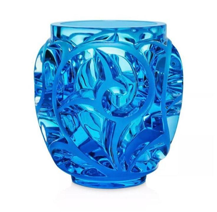 Lalique Pale Blue Tourbillon Vase: Originally created in 1929 by Rene Lalique, the magnificent crystal Tourbillon Vase combines graphic, geometric and poetic design to grand effect. Keep on your credenza or dining room table for a lust