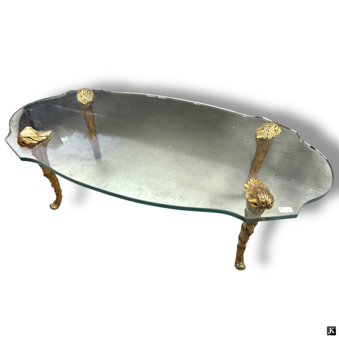 Maison Charles Gilt Bronze & Glass Coffee Table: Maison Charles Gilt Bronze & Glass Coffee Table. Unsigned. Good condition. Measures 15-1/4" H x 49-1/2" L x 25-1/4" W, glass top 3/4" thick.