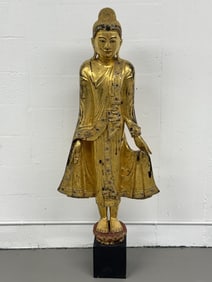 A Large Gilt Carved Wooden Southeast Asian Buddha