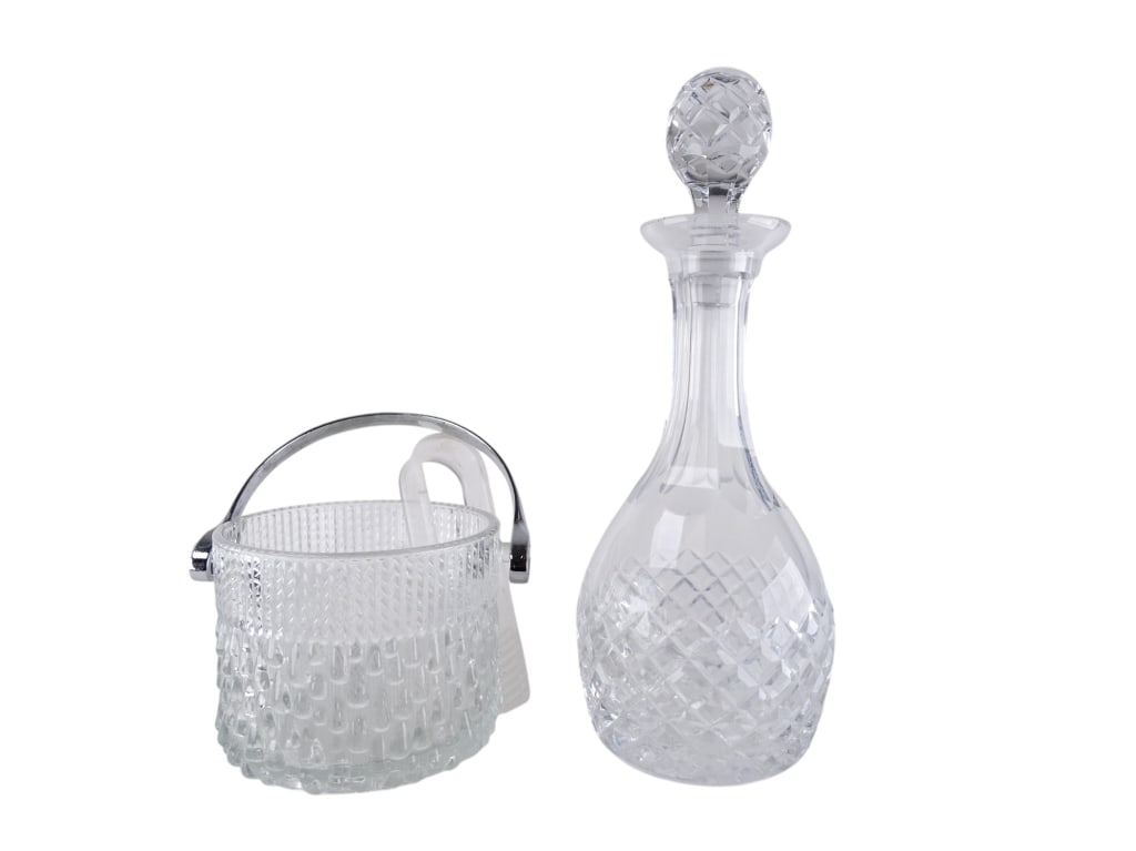 Lot Vintage Textured Glass Decanter Ice Bucket: Stunning lot including a textured glass decanter and ice bucket. Bucket is marked Teleflora France and includes ice tongs. Bucket shows wear on the handle and decanter has light fogging of the glass,