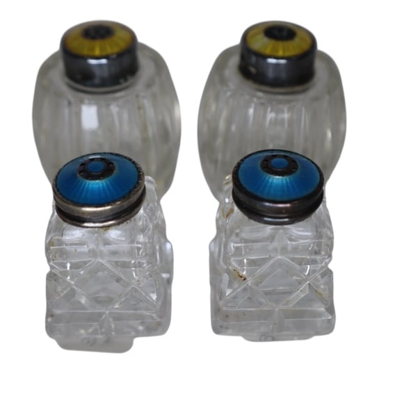 Lot Vintage Meka Sterling 925 Salt Pepper Shakers: Very pretty lot of four salt pepper shakers, 2 of each style. The yellow topped shakers are marked ' Meka Sterling Denmark" and the blue topped shakers are marked 'FI. Sterling 925 Norway'. Tarnishing