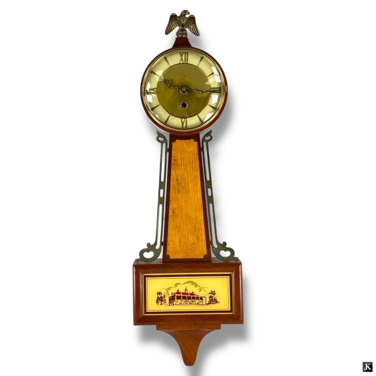 Vintage 8 Day Banjo Clock: Vintage 8 Day Banjo Clock Mechanical banjo-style wall clock featuring an American patriotic motif. Movement is stamped "Made in France." Includes key. Appears in good overall condition with minor wear