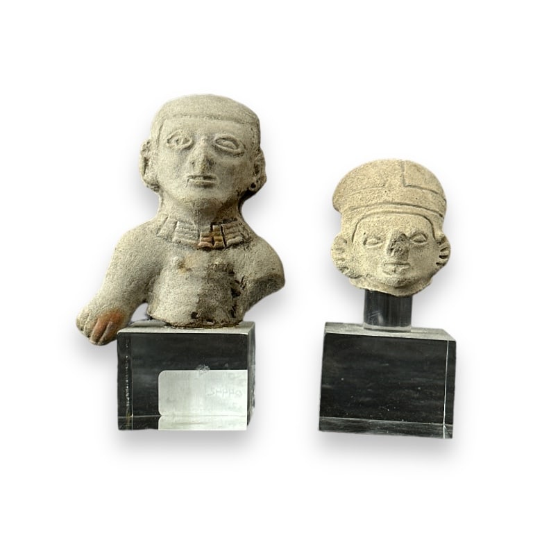 2 Pre-Colombian White Stoneware Busts On Bases: A lot of 2 Pre-Colombian white stoneware busts of deities. Each with acrylic bases. Tallest measures approx. 5 1/4" height overall including base. Shows wear typical with age to pottery. Some minor ni