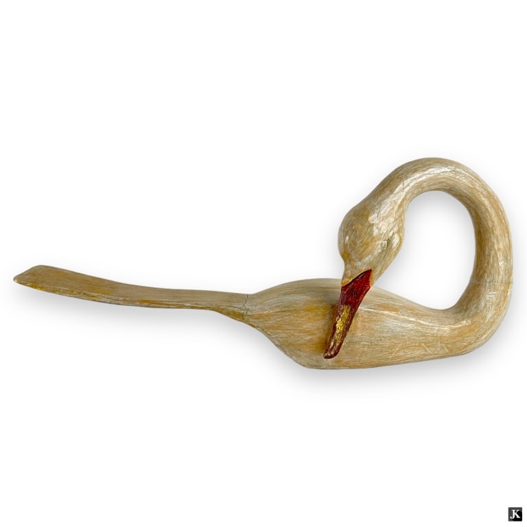 Vintage Indonesian Polychrome Wood Duck Sculpture: A vintage Indonesian hand carved and polychrome wood sculpture depicting a duck or goose. Measures approx. 10" height x 25" lendth x 5 3/4" depth. Has a split at tail. Otherwise, appears in overall go