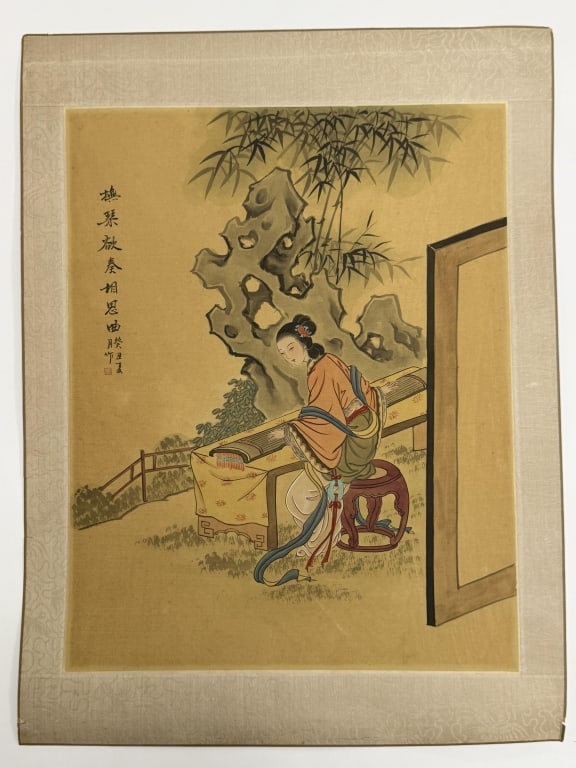Artist Unknown Chinese Print On Silk: Artist unknown Chinese print on silk "Woman Playing Guqin Instrument". Writing and seal printed upper left. Backed by paper and bordered with decorative silk. Minor wear and small tears along the edge