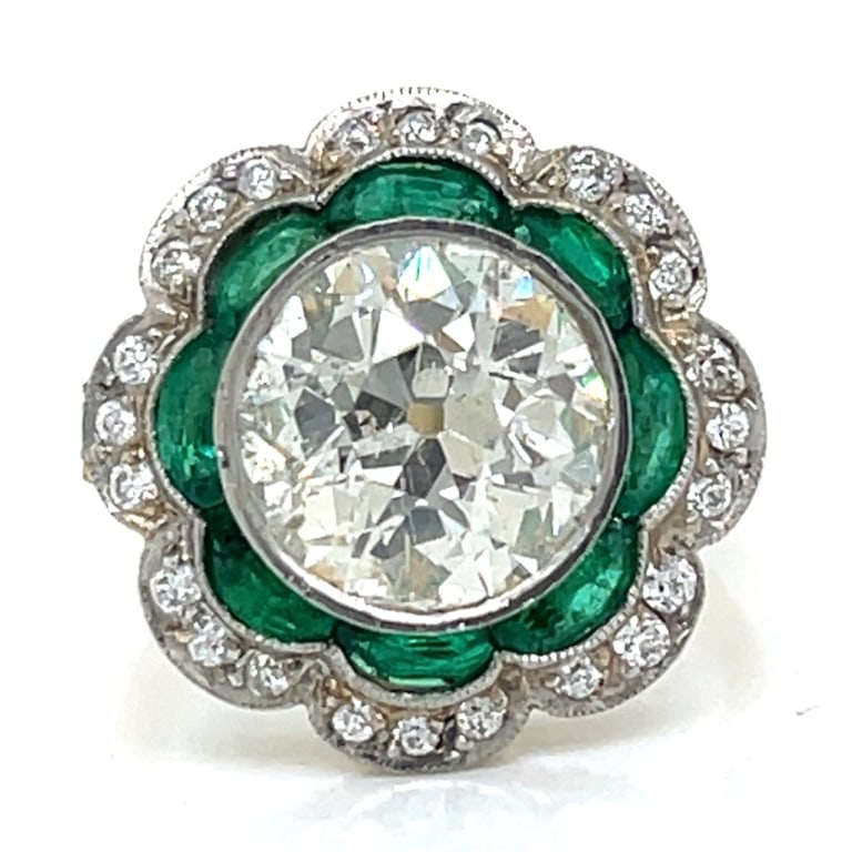 Art Deco Platinum & 18K Yellow Gold 4.03 Ct. Diamo: Item # 12967 Category Rings Art Deco Platinum & 18K Yellow Gold 4.03 Ct. Diamond and Emerald Ring Weighing 6.5 grams Set with a 4.03 Ct. European-cut Diamond K-L Color, SI3 Clarity Along with 30 Europ
