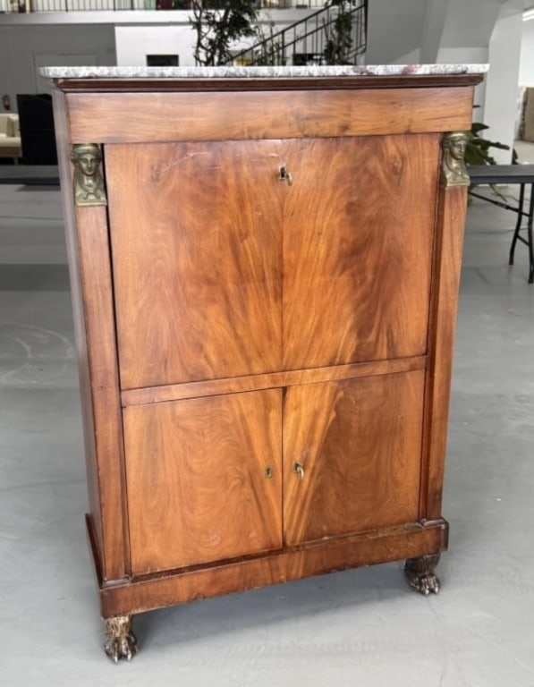 Empire Marble Top Drop Front Secretary: Empire Marble-Top Drop-Front SecretaryElegant Empire secretary with marble top, fitted drop-front writing surface, and bronze mounts. The case is raised on carved lion paw feet, with key included.Heig