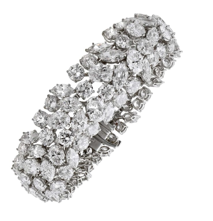 Harry Winston Platinum Diamond Bracelet with 63.54: Indulge in unparalleled elegance with the Harry Winston Diamond Bracelet, a stunning piece crafted from exquisite platinum. This luxurious bracelet features an impressive total of 63.54 carats of diam