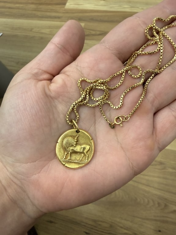 Van Cleef & Arpels 18k Gold Zodiac Taurus: Van Cleef & Arpels 18 Karat Yellow Gold Gold Zodiac Taurus pendant. Signed VCA FRANCE. Numbered 16V12 - 67. Attached to a 18 Karat Yellow Gold Chain Necklace. Stamped 750 & Hallmarked. Total Weight 19