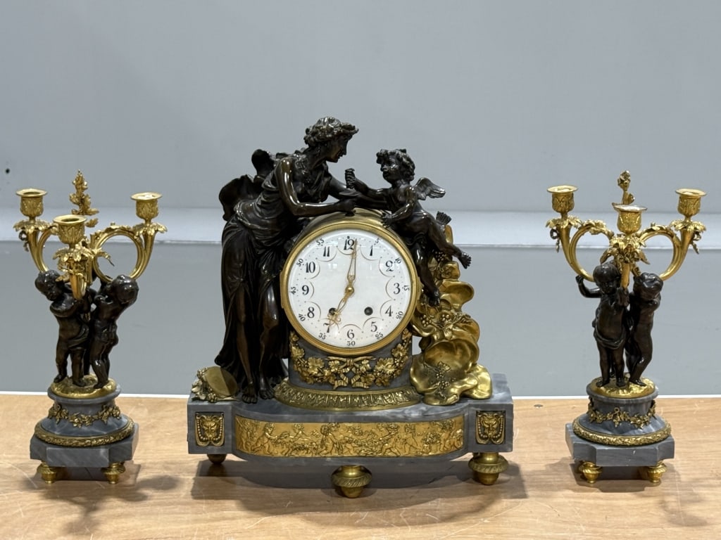 LARGE, French (3) Three Piece Clock Set Bronze: LARGE, French (3) Three Piece Clock Set Bronze & Marble. Clock Measures 20 inches high x 17 1/2 inches wide x 7 inches deep. Sticks Measures 17 inches high x 6 inches wide.