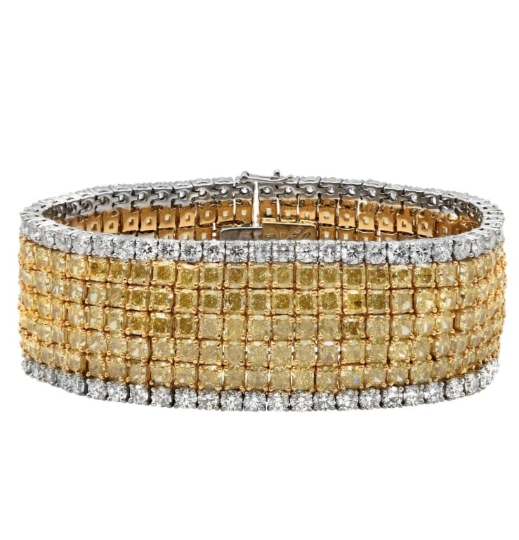 Luxury 18K Yellow Gold & Platinum Diamond Bracelet: Share Experience the epitome of luxury with the stunning 18K Yellow Gold & Platinum Diamond Bracelet, a breathtaking creation from Vivid Diamonds. This masterpiece is designed for those who appreciate