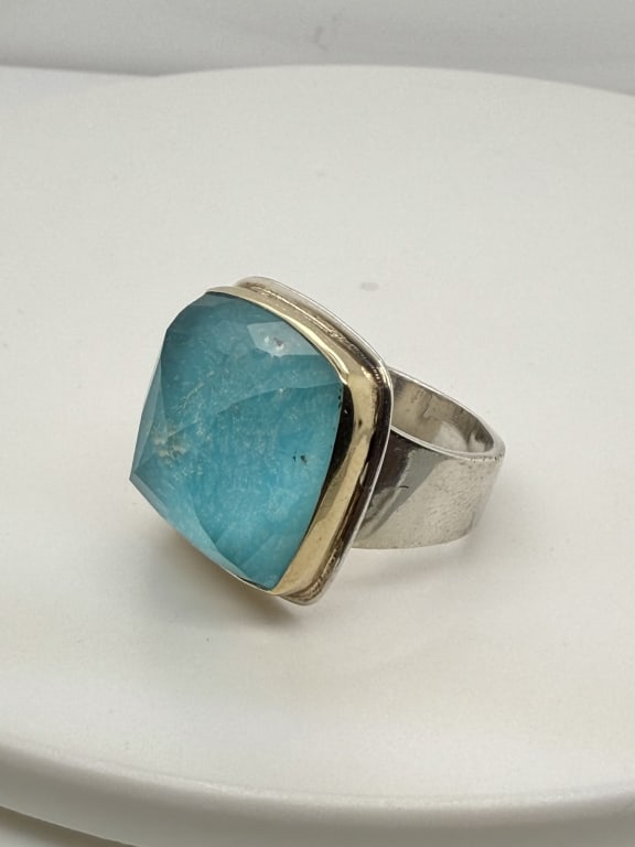Vintage Greek Gold & Silver Gemstone Ring: Vintage Greek 18K gold and .925 sterling silver blue gemstone ring. Trim around gemstone is 18K gold, rest of the ring is sterling silver. Stamped 'EVANGELATOS, 750, 925' on inside. Some signs of
