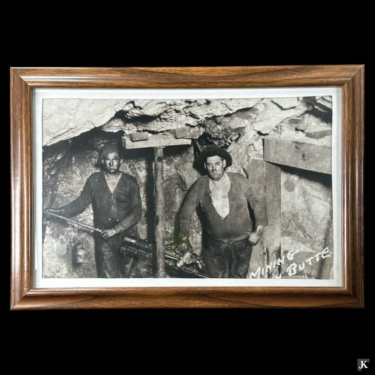 Print Of Miners In Butte Montana Framed: Print of miners in the Butte Montana mines. Mounted in a wooden frame. Measures approx. 15 1/2" height x 22 1/2" width overall including frame. Appears in overall good condition. KEYWORDS: