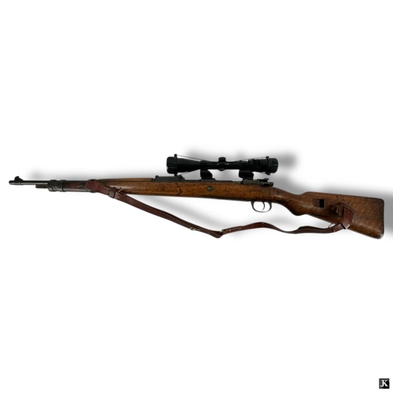 WWII Mauser Nazi Rifle Mod 98 w/ Scope: WWII Mauser Nazi Rifle Model 98 with a later Bushnell Scope. Marked throughout with logos, numbers. Overall good condition consistent with age. The gallery does not warranty the working order.