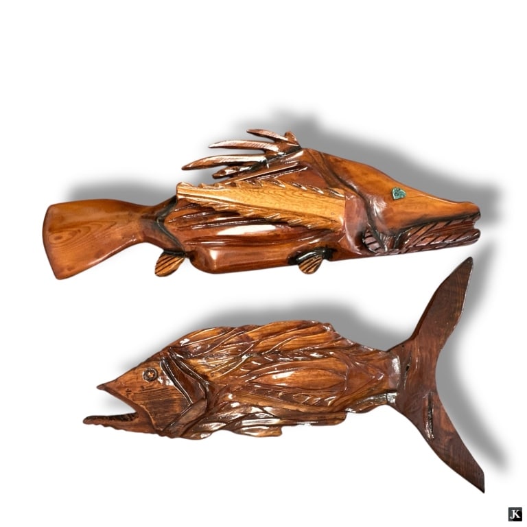 2 Carved Wood Fish Wall Mounts: 2 Carved Wood Fish Wall Mounts. Possibly Red Cedar or Red Cypress. Heavy varnish. One is inscribed Michael Eshack and dated 2015. Overall good condition. Measures 13" H x 36-1/2" L & 19-1/2" H x 34"