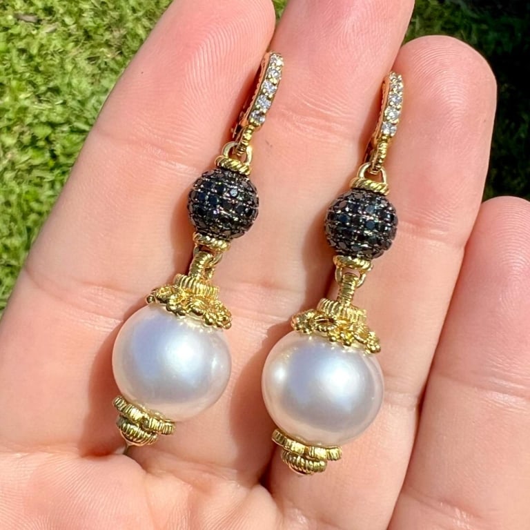 18K Yellow Gold South Sea Pearl & Black Diamond Ea: Item # 12437 Category Earrings 18K Yellow Gold South Sea Pearl & Black Diamond Earrings Weighing 23.1 grams Set with 2 South Sea Pearls measuring 14.8mm Along with 14 Diamonds weighing app. 0.40 Ct. F
