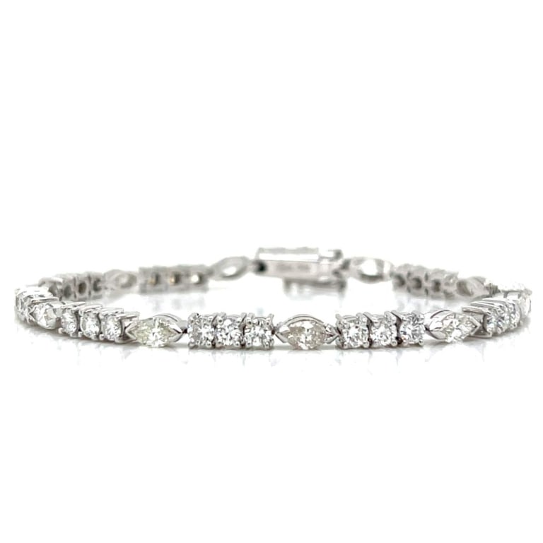18K White Gold 3.70 Ct. Diamond Bracelet: Item # 12362 Category Bracelets 18K White Gold 3.70 Ct. Diamond Bracelet Weighing 10.4 grams Set with 30 Round Diamonds weighing app. 2.40 Ct. Along with Marquise Diamonds weighing app. 1.30 Ct. E-G