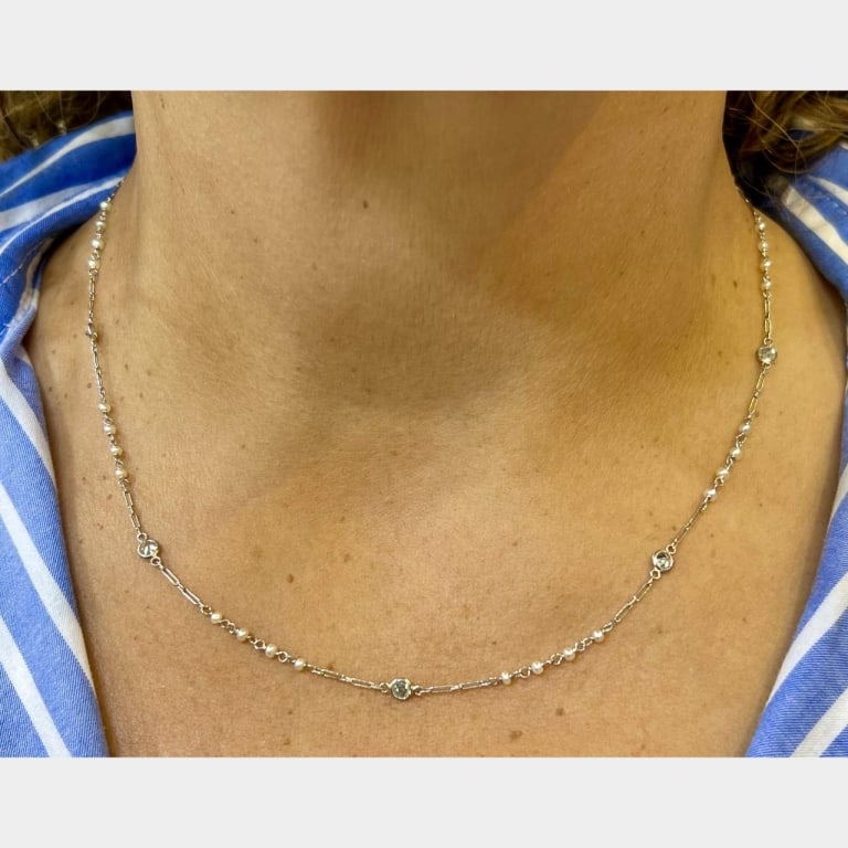 Platinum Natural Pearl & Diamond by the Yard Neckl: Item # 12302 Category Necklaces Platinum Natural Pearl & Diamond by the Yard Necklace Weighing 3.5 grams Set with 9 European-cut Diamonds weighing app. 1.35 Ct. H-I Color, VS1-I1 Clarity Natural Pearl