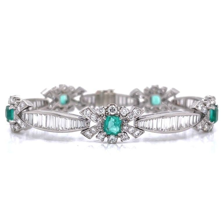 Art Deco Platinum Emerald & Diamond Bracelet: Item # 12196 Category Bracelets Art Deco Platinum Emerald & Diamond Bracelet Weighing 27.2 grams Set with 72 Baguette Diamonds weighing app. 6.00 Ct. Along with 90 Diamonds weighing app. 3.00 Ct. D-F