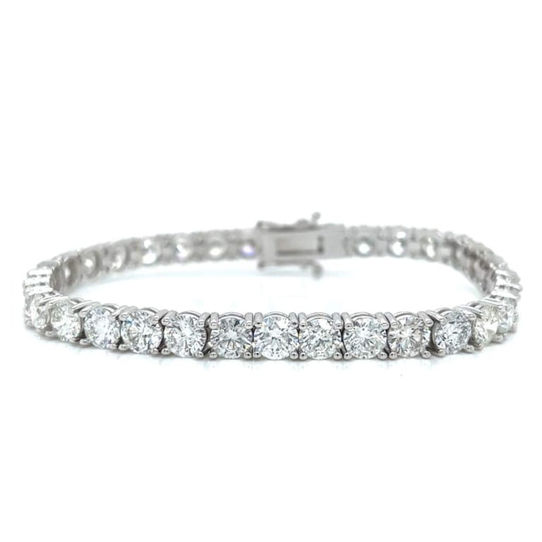 18K White Gold 17.31 Ct. Diamond Tennis Bracelet: Item # 10133 Category Bracelets 18K White Gold 17.31 Ct. Diamond Tennis Bracelet Weighing 19.2 grams Set with 33 Diamonds weighing 17.31 Ct. F-G Color, SI1-SI3 Clarity 7 inches in length