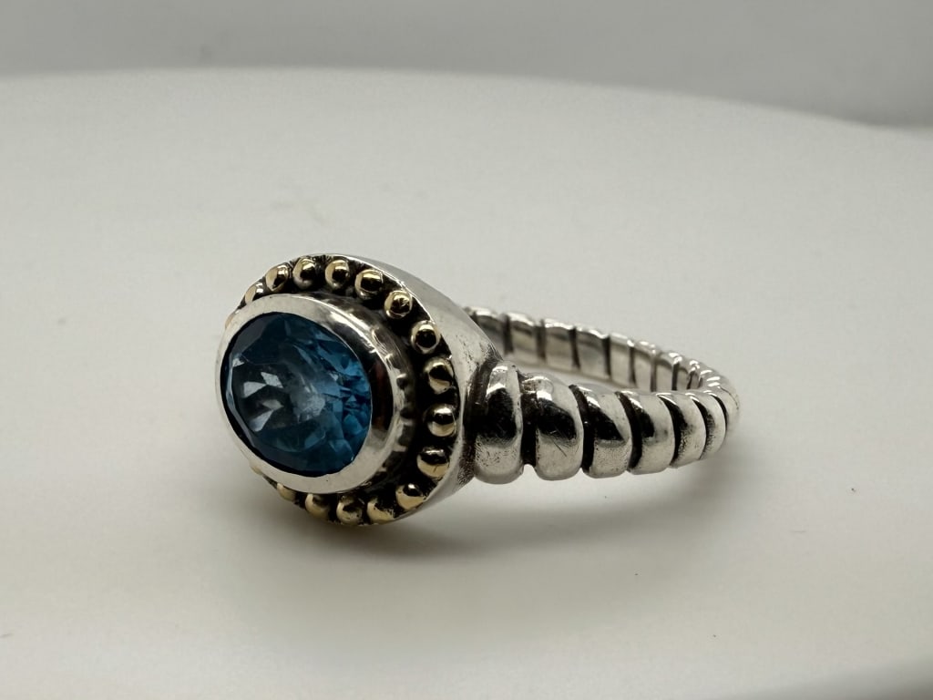 Vintage Sterling Silver 18k Gold Topaz Ring: Vintage Benham Jewelry Corp. 925 sterling silver w/ 18k white gold beading blue topaz twisted wire ring. Stamped 'BJC 925 18K inside. Some signs of wear, otherwise in good condition. Size 10 Weight 7g
