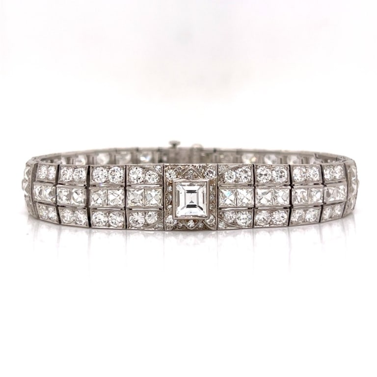 Art Deco Platinum 20.05 Ct. Diamond Diamond Bracel: Item # 13584 Category Bracelets Art Deco Platinum 20.05 Ct. Diamond Diamond Bracelet Weighing 30.0 grams Set with an app. 1.60 Ct. Diamond in Center D Color, VS2 Clarity Along with 128 European-cut Di