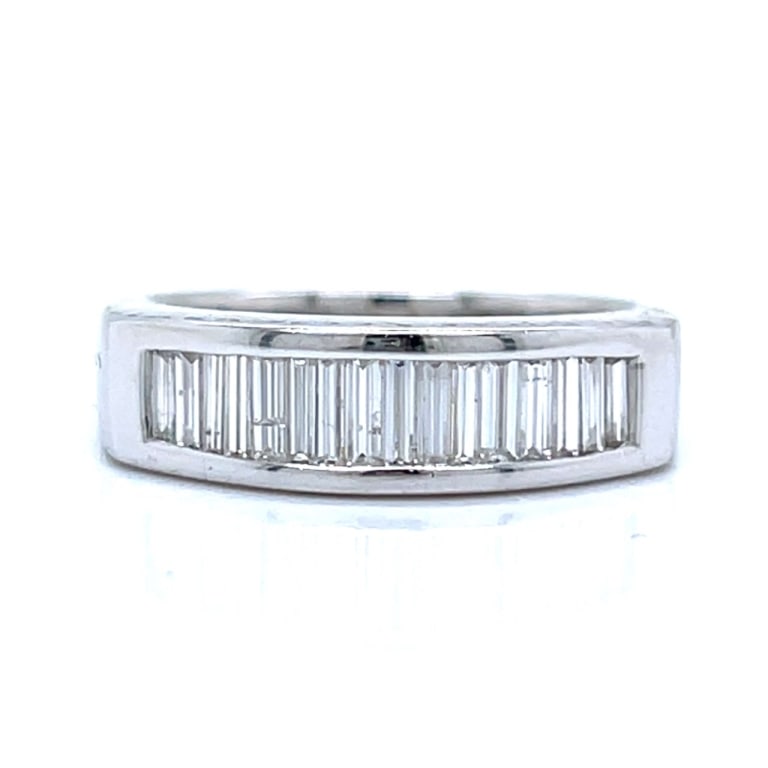 18K White Gold 1.00 Ct. Diamond Anniversary Band: Item # 13513 Category Rings 18K White Gold 1.00 Ct. Diamond Anniversary Band Weighing 6.3 grams Set with 16 Baguette Diamonds weighing app. 1.00 Ct. F-G Color, VS1-SI1 Clarity Ring Size 6.5