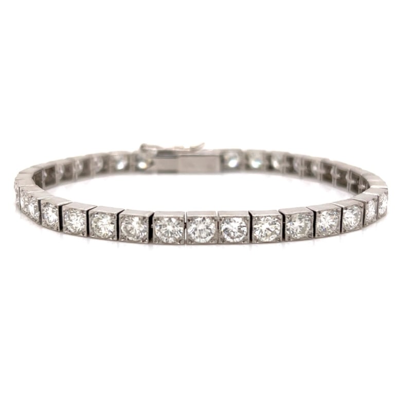 Platinum 12.00 Ct. Diamond Tennis Bracelet: Item # 13553 Category Bracelets Platinum 12.00 Ct. Diamond Tennis Bracelet Weighing 23.4 grams Set with 37 Diamonds weighing app. 12.00 Ct. H-I Color, VS1-VS2 Clarity 7.25 inches in length