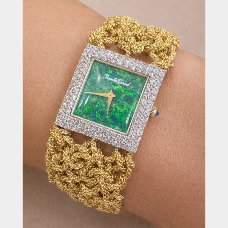 BUCHE GIROD French 18K Yellow Gold Opal & Diamond: Item # 13592 Category Watches BUCHE GIROD French 18K Yellow Gold Opal & Diamond Watch Weighing 105.8 grams Set with an original Black Opal dial Along with 84 Diamonds weighing app. 3.20 Ct. F-G
