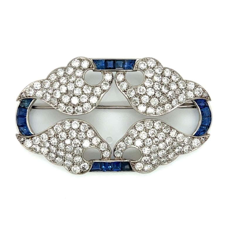 Art Deco Platinum Diamond & Sapphire Brooch: Item # 8760 Art Deco Platinum Diamond & Sapphire Brooch Weighing 17.2 grams Set with 144 Diamonds weighing app. 12.00 Ct. G-I Color, VS1-SI1 Clarity Along with 16 Sapphires weighing app. 3.50 Ct. 2.5